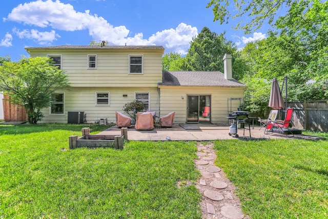 back of property featuring a patio, central air condition unit, and a chimney