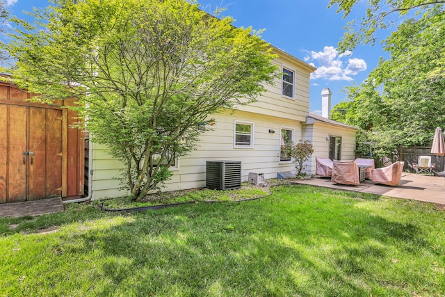 back of property featuring a patio and central AC unit