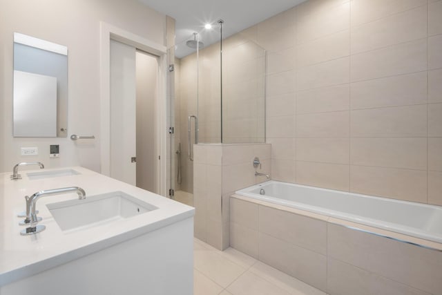 2773 N Hampden Ct Unit 401, Chicago, IL 60614 - bathroom with a stall shower, tiled tub, double vanity, and tile patterned floors
