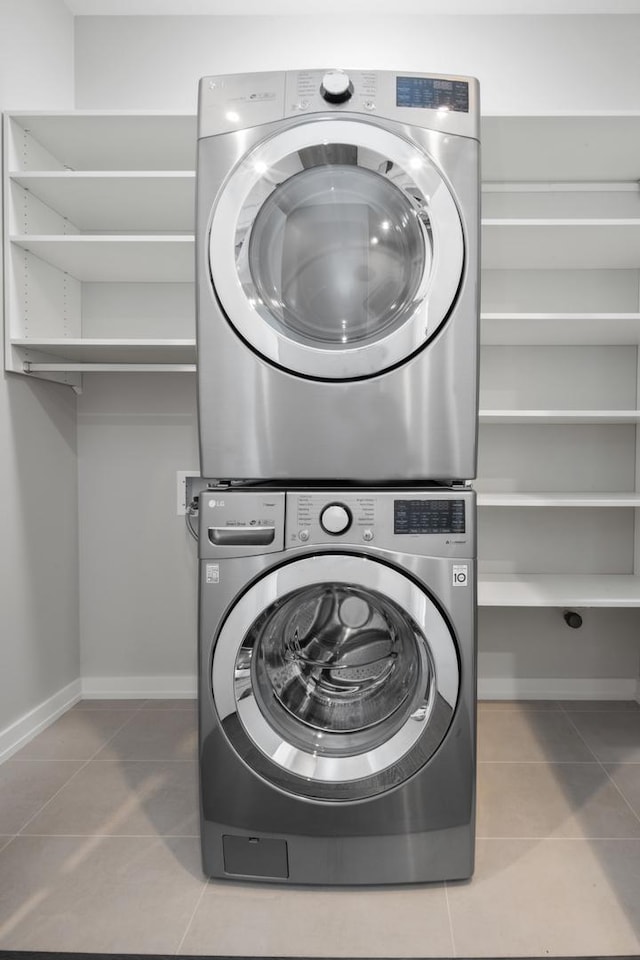 2773 N Hampden Ct Unit 401, Chicago, IL 60614 - laundry area with stacked washer / drying machine and tile patterned flooring