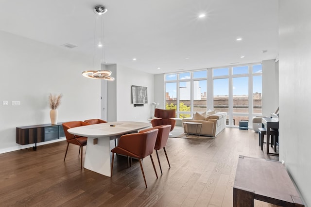 2773 N Hampden Ct Unit 401, Chicago, IL 60614 - dining area with dark wood-style flooring, floor to ceiling windows, and recessed lighting