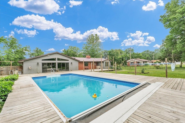 3408 E University Ave, Urbana, IL 61802 - view of swimming pool with a wooden deck and view of wooded area