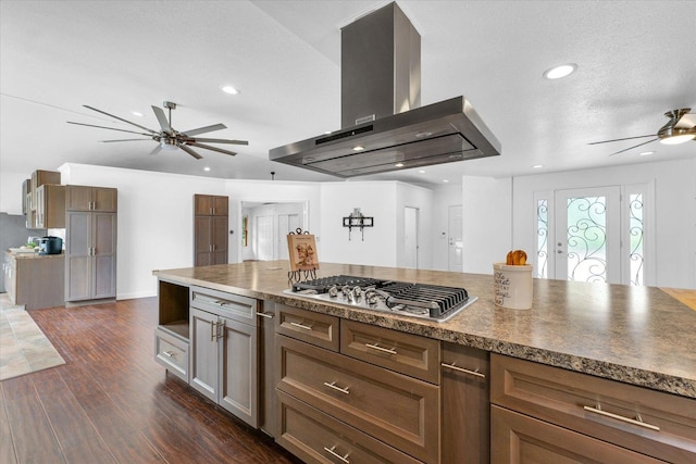 3408 E University Ave, Urbana, IL 61802 - kitchen with wall chimney exhaust hood, ceiling fan, stainless steel gas stovetop, recessed lighting, and dark wood finished floors