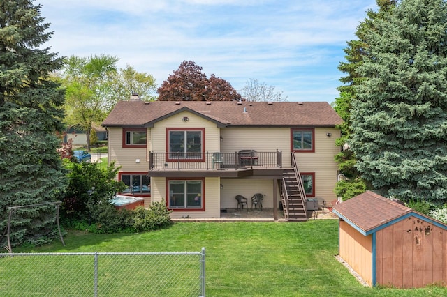46 Feece Dr, Batavia, IL 60510 - back of property with a shed, stairway, an outbuilding, a chimney, and a wooden deck