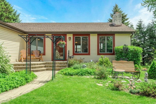 46 Feece Dr, Batavia, IL 60510 - ranch-style house featuring a front yard, a chimney, and roof with shingles