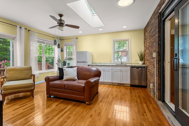 711 W Iowa St, Urbana, IL 61801 - living room with a skylight, light wood finished floors, and healthy amount of natural light