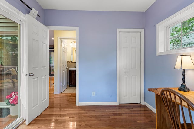 711 W Iowa St, Urbana, IL 61801 - bedroom with light wood finished floors and baseboards