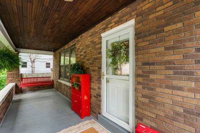 711 W Iowa St, Urbana, IL 61801 - doorway to property with a porch and brick siding