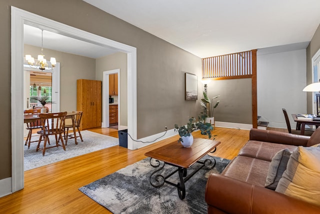711 W Iowa St, Urbana, IL 61801 - living area with a chandelier and light wood-style floors