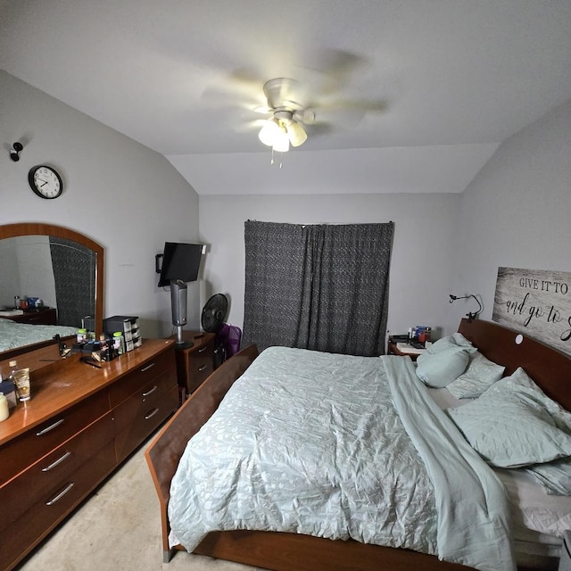 bedroom with lofted ceiling, light carpet, and a ceiling fan