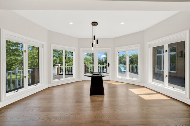 unfurnished sunroom featuring plenty of natural light and french doors