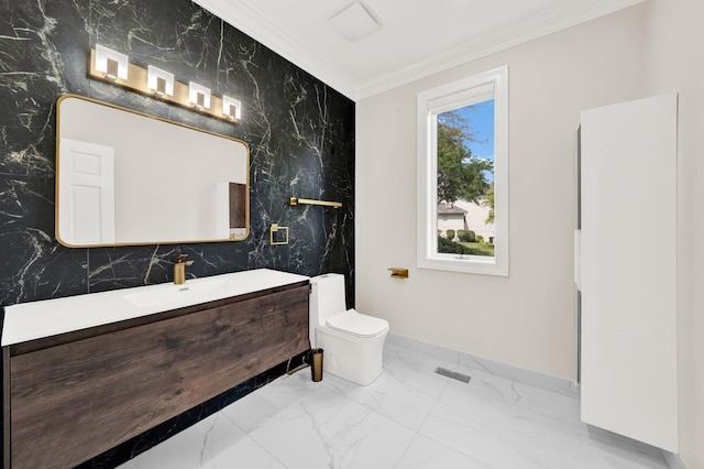 bathroom featuring baseboards, marble finish flooring, crown molding, vanity, and toilet