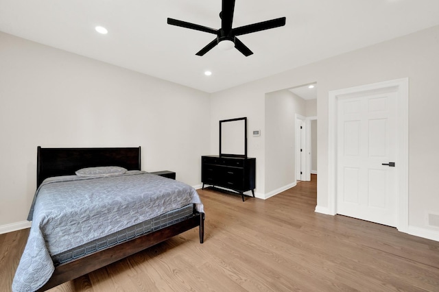 bedroom with light wood-style floors, baseboards, recessed lighting, and a ceiling fan