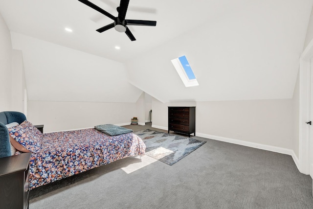 carpeted bedroom featuring lofted ceiling, a skylight, baseboards, a ceiling fan, and recessed lighting
