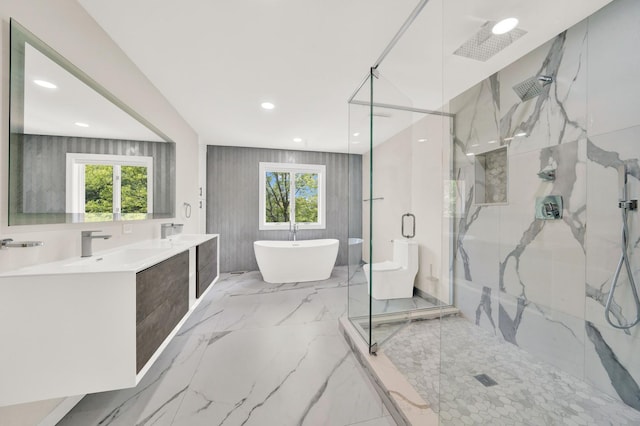 full bath featuring a marble finish shower, a soaking tub, healthy amount of natural light, marble tiled flooring, and recessed lighting