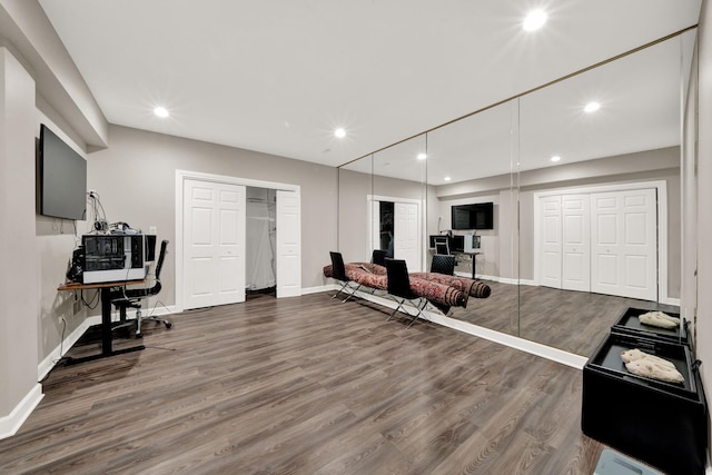 office space featuring wood finished floors, baseboards, and recessed lighting