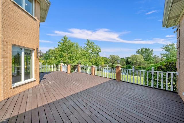 wooden deck featuring view of wooded area