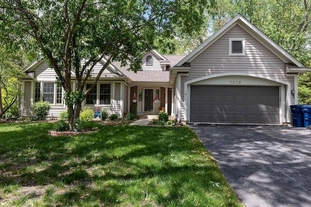 7038 Bentley Dr, Gurnee, IL 60031 - ranch-style home featuring driveway, an attached garage, a front lawn, and a shingled roof