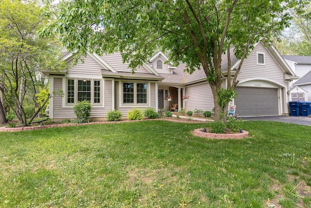 7038 Bentley Dr, Gurnee, IL 60031 - view of front of property featuring asphalt driveway, a garage, a front lawn, and roof with shingles