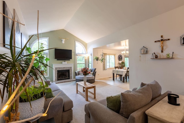 7038 Bentley Dr, Gurnee, IL 60031 - carpeted living room featuring a chandelier, a fireplace with raised hearth, and high vaulted ceiling