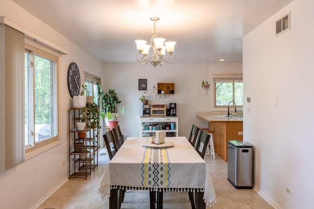 7038 Bentley Dr, Gurnee, IL 60031 - dining room with a chandelier, light tile patterned flooring, and baseboards