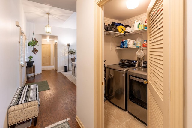 7038 Bentley Dr, Gurnee, IL 60031 - washroom with washer and dryer, light wood finished floors, and baseboards