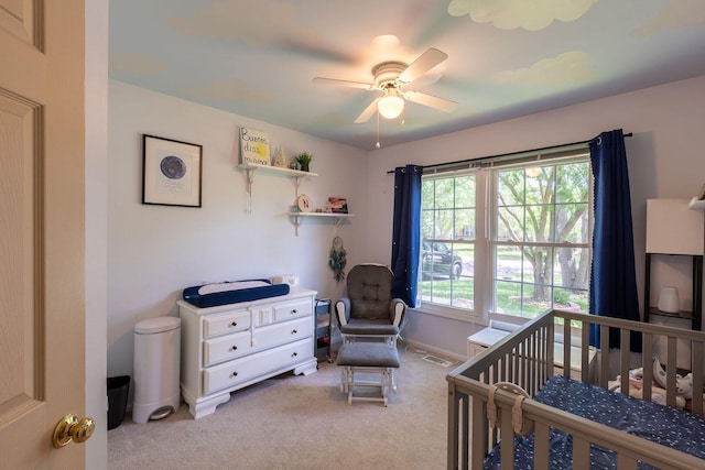 7038 Bentley Dr, Gurnee, IL 60031 - carpeted bedroom with a nursery area, baseboards, and ceiling fan