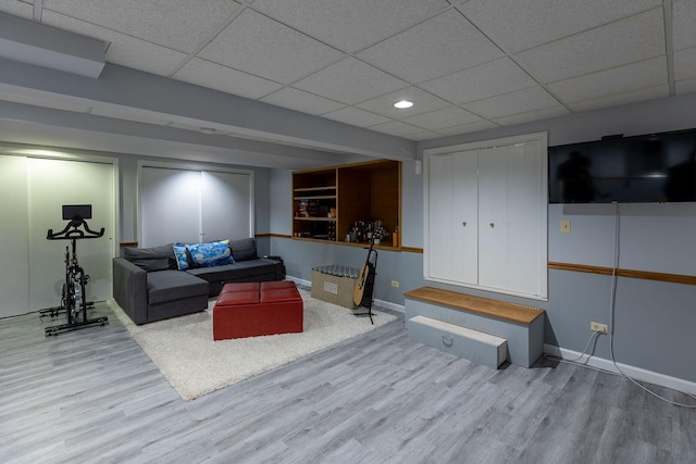 7038 Bentley Dr, Gurnee, IL 60031 - living area featuring wood finished floors, a paneled ceiling, baseboards, and recessed lighting