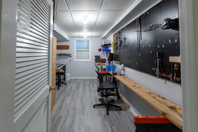 7038 Bentley Dr, Gurnee, IL 60031 - home office with a workshop area, baseboards, wood finished floors, and a drop ceiling