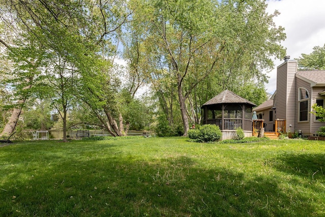 7038 Bentley Dr, Gurnee, IL 60031 - view of green lawn featuring a gazebo and a wooden deck