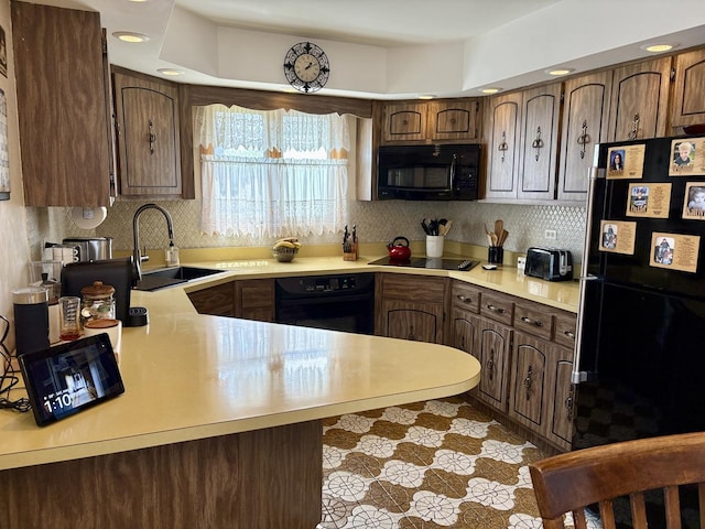 5600 Saint Charles Rd, Berkeley, IL 60163 - kitchen with black appliances, a sink, light countertops, tasteful backsplash, and recessed lighting