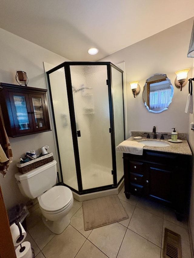 5600 Saint Charles Rd, Berkeley, IL 60163 - bathroom featuring tile patterned flooring, toilet, a stall shower, and vanity