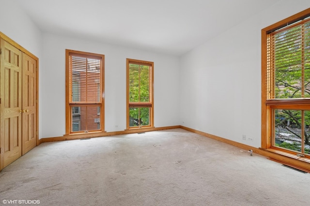 456 E N Water St Unit H, Chicago, IL 60611 - unfurnished bedroom featuring baseboards and carpet flooring
