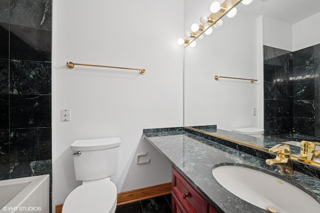 456 E N Water St Unit H, Chicago, IL 60611 - bathroom featuring toilet, vanity, baseboards, and tile patterned flooring