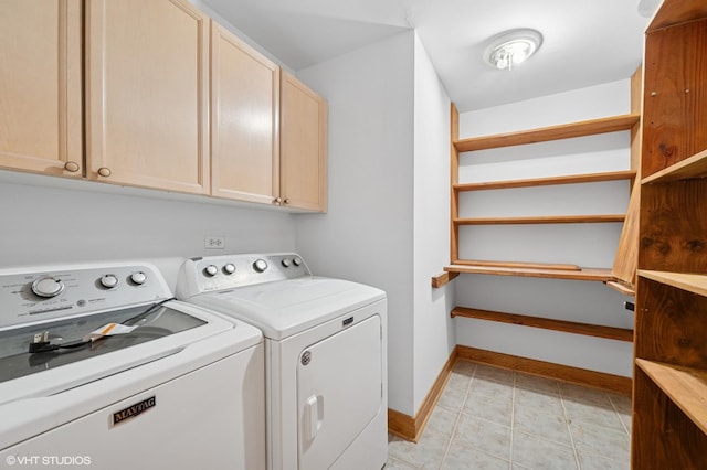 456 E N Water St Unit H, Chicago, IL 60611 - washroom with washer and clothes dryer, cabinet space, and baseboards