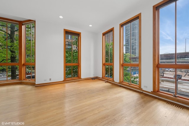 456 E N Water St Unit H, Chicago, IL 60611 - unfurnished room featuring plenty of natural light, light wood-type flooring, and recessed lighting
