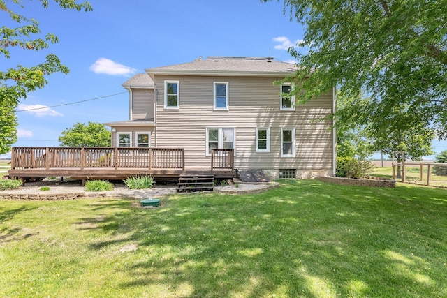 4731 E 10th Rd, Earlville, IL 60518 - rear view of property with a wooden deck and a lawn
