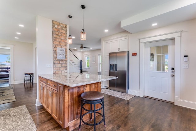 4731 E 10th Rd, Earlville, IL 60518 - kitchen featuring stainless steel refrigerator with ice dispenser, baseboards, light stone countertops, dark wood-style flooring, and recessed lighting