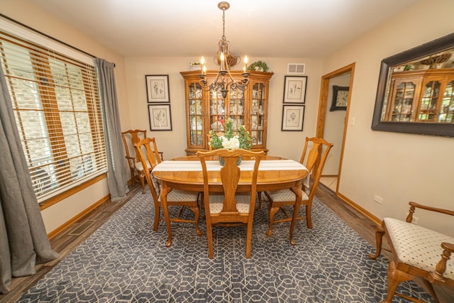 25037 W Liberty Dr, Channahon, IL 60410 - dining space with a chandelier, healthy amount of natural light, wood finished floors, and baseboards