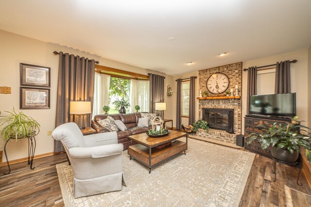 25037 W Liberty Dr, Channahon, IL 60410 - living area featuring wood finished floors, a fireplace, and baseboards