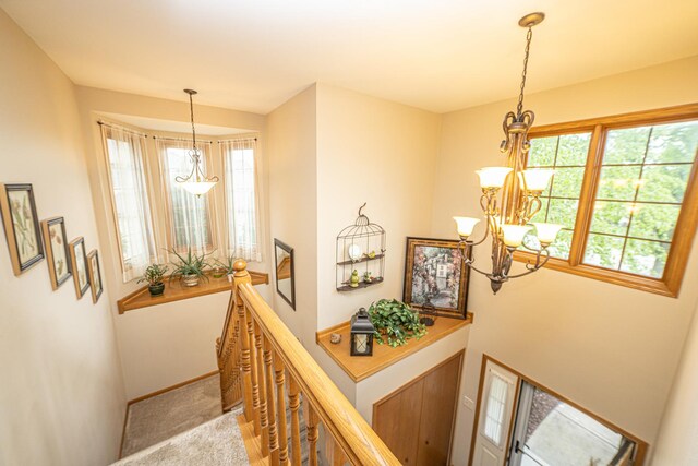 25037 W Liberty Dr, Channahon, IL 60410 - stairs featuring a chandelier, carpet floors, and baseboards