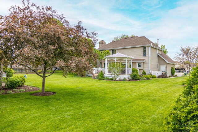 25037 W Liberty Dr, Channahon, IL 60410 - rear view of property featuring a gazebo, a chimney, a lawn, and a shingled roof