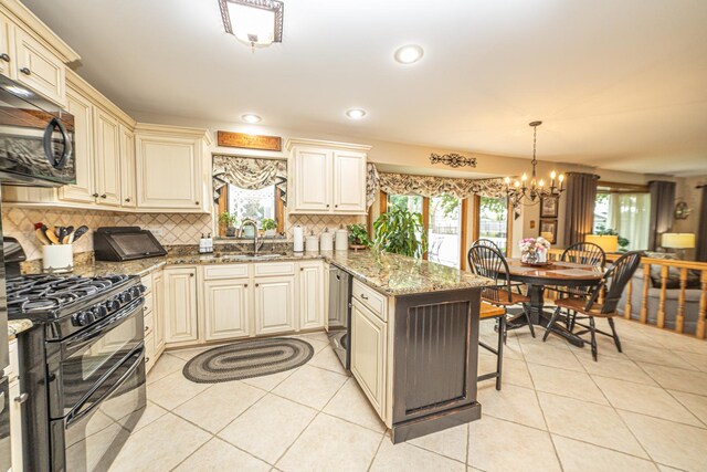 25037 W Liberty Dr, Channahon, IL 60410 - kitchen featuring cream cabinetry, black appliances, a sink, a peninsula, and decorative backsplash