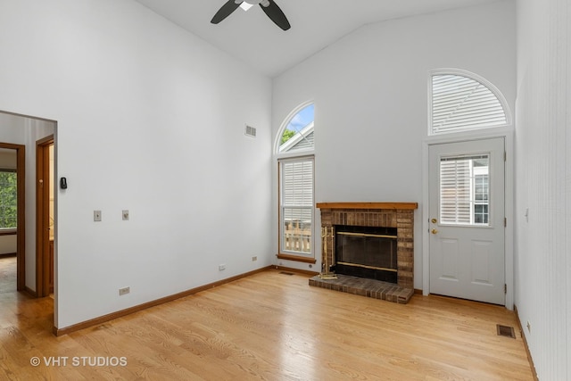 6109 Golfview Dr Unit 6109, Gurnee, IL 60031 - unfurnished living room featuring high vaulted ceiling, light wood-style flooring, ceiling fan, and a brick fireplace