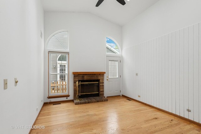 6109 Golfview Dr Unit 6109, Gurnee, IL 60031 - unfurnished living room featuring a ceiling fan, light wood-style flooring, a fireplace, and high vaulted ceiling