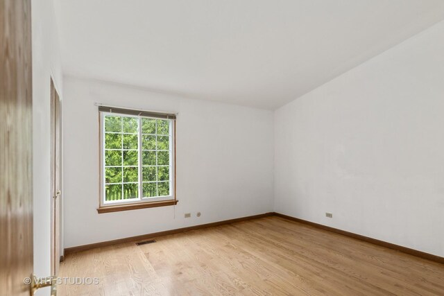 6109 Golfview Dr Unit 6109, Gurnee, IL 60031 - spare room with light wood-style floors and baseboards