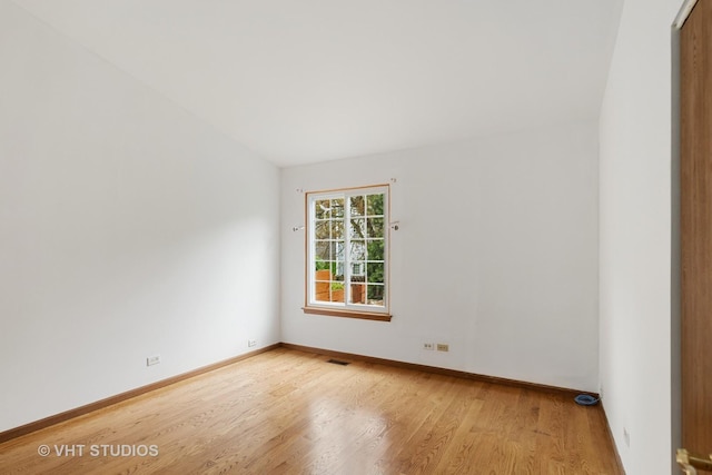 6109 Golfview Dr Unit 6109, Gurnee, IL 60031 - spare room featuring wood finished floors and lofted ceiling