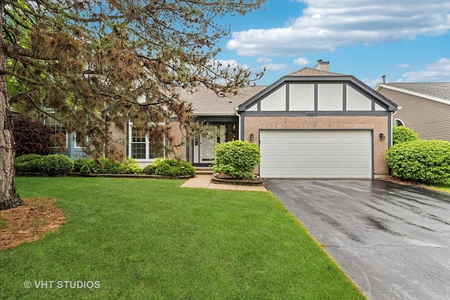 6109 Golfview Dr Unit 6109, Gurnee, IL 60031 - tudor-style house with driveway, an attached garage, a front yard, brick siding, and a chimney