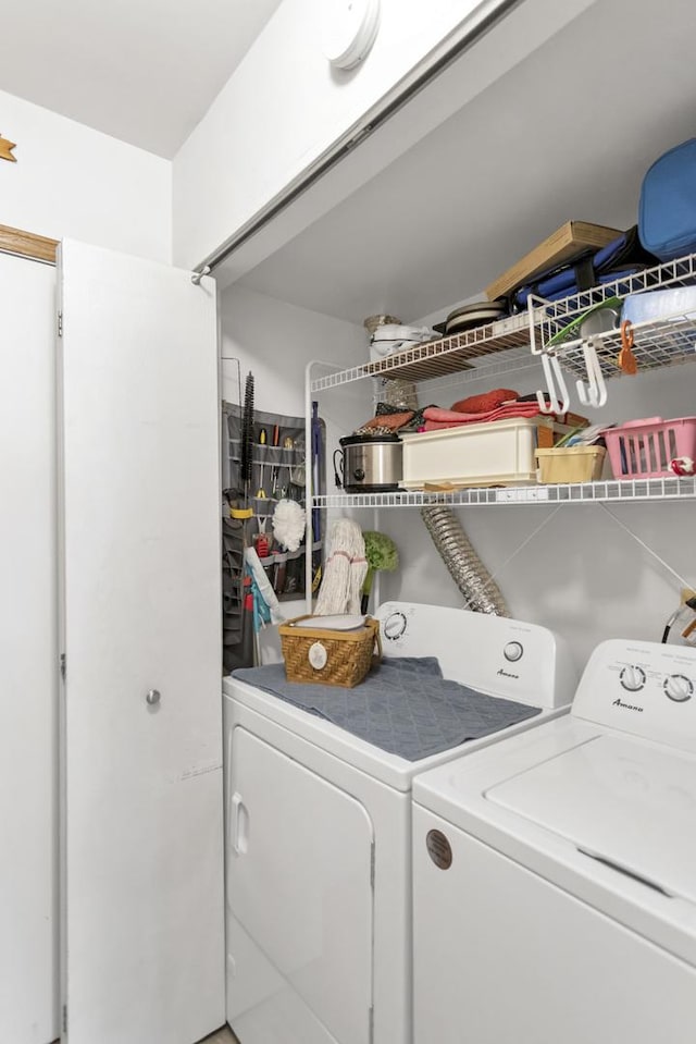 clothes washing area featuring washing machine and clothes dryer