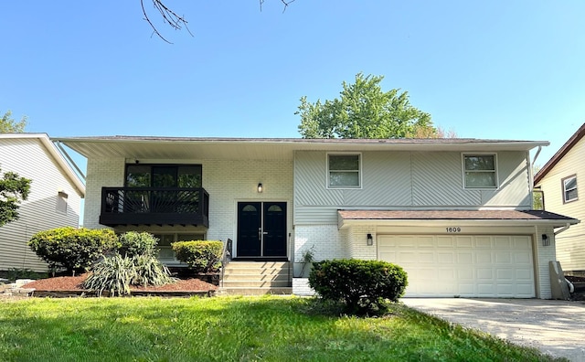 bi-level home with brick siding, driveway, a garage, and a balcony